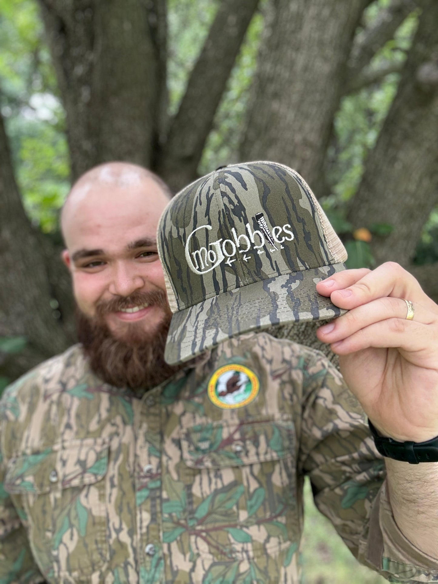 "MoGobbles" Formed Trucker Bottomland/Tan with Ivory Text.